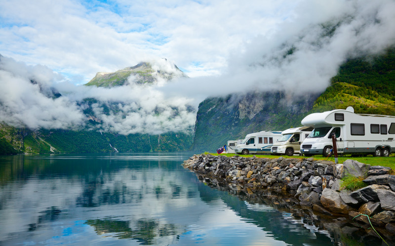 RV Motorhomes by lake in mountains in the winter