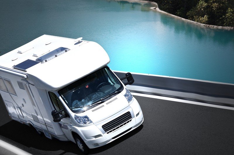 Motorhome RV on the road by river Southeast Financial - motorhome gap insurance