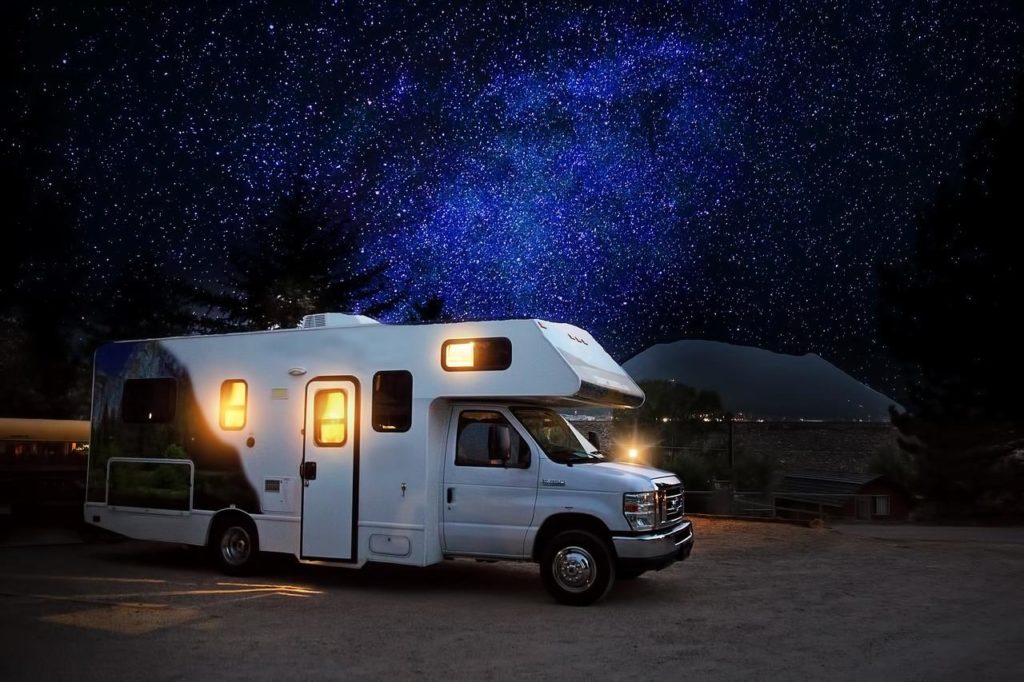 RV parked under the night sky