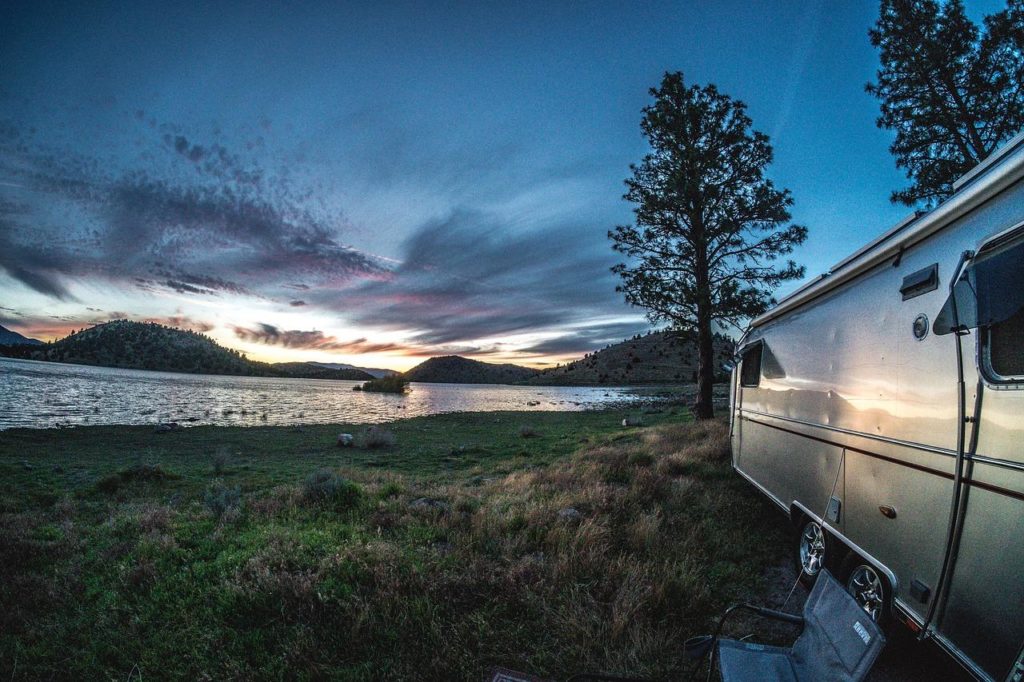 RV parked next to a lake
