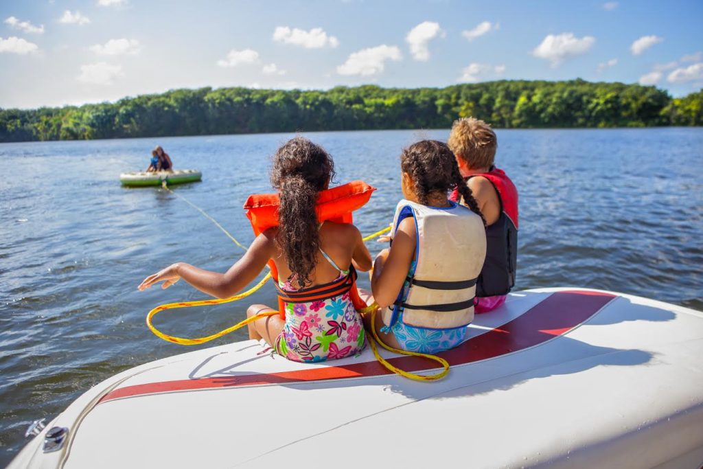 Kids on a boat with lifejackets